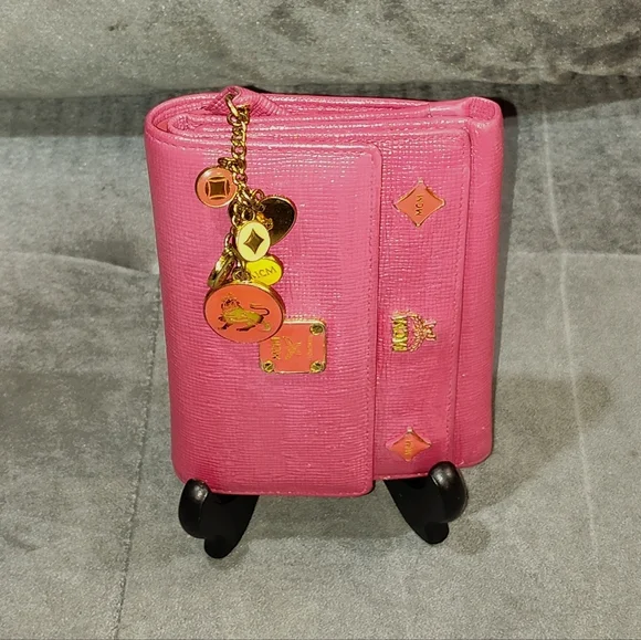 EUC MCM SAFFIANO LEATHER COMPACT WALLET DECORATIVE METAL MCM BAGDES & CHARMS
